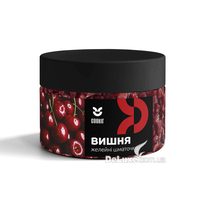 Банка желейних шматочків Cookit Вишня з чорною кришкою, темно-червоні кубики видно крізь стінку