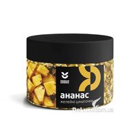Банка желейных кусочков Cookit Ананас с чёрной крышкой, светло-жёлтые кубики видны через стенку