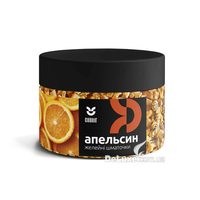 Банка желейних шматочків Cookit Апельсин з чорною кришкою, помаранчеві кубики видно крізь стінку